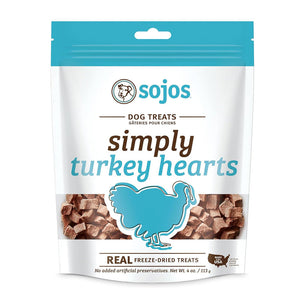 A 4 oz white and teal blue bag of Sojos Simply Turkey Hearts Dog Treats. No added artificial preservatives. See-through window at the bottom of the bag shows product inside - very small, cube shaped brown treats.