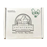 Plain white cardboard box, with text that reads: Be the hero of your pet's story. Center logo says Solutions Pet Products, Small Farms. Big Ideas. Outline of a chicken in the top right corner, with the letters CKN inside it.