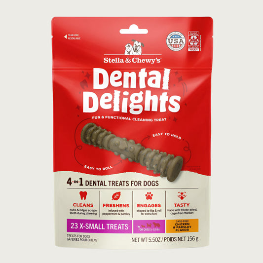5.5 oz bag of Stella & Chewy's Dental Delights, 4-in-1 Dental Treats for Dogs. Cleans, Freshens, Engages, Tasty. Contains 23 X-Small treats for dogs between 5-15 lbs. Photo of one treat is in the center; it looks like a narrow stick-like hourglass with ridges and bumps.
