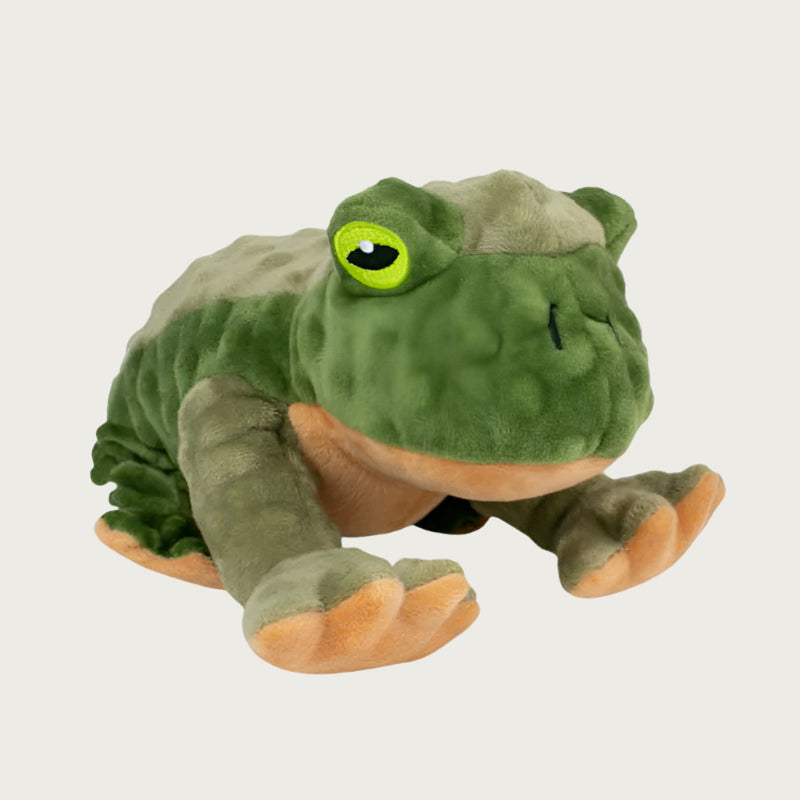 Plush, squatting frog dog toy with chunky legs. Features two-toned bumpy green plush, and tan underside. Large embroidered bright green eyes.