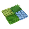Image of four of the Foraging Mats interlocked together. Two of the Grass design, one of the Clover design, and one of the Rock design. They connect to make a larger area with varying textures.