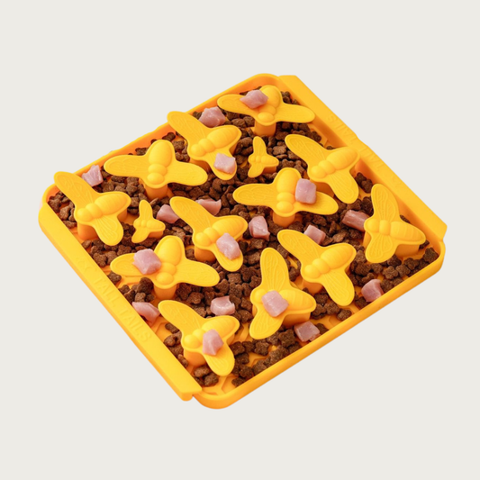 Image of the Busy Bee style Foraging Mat with a mix of treats and kibbles spread in it and on top of the bees.