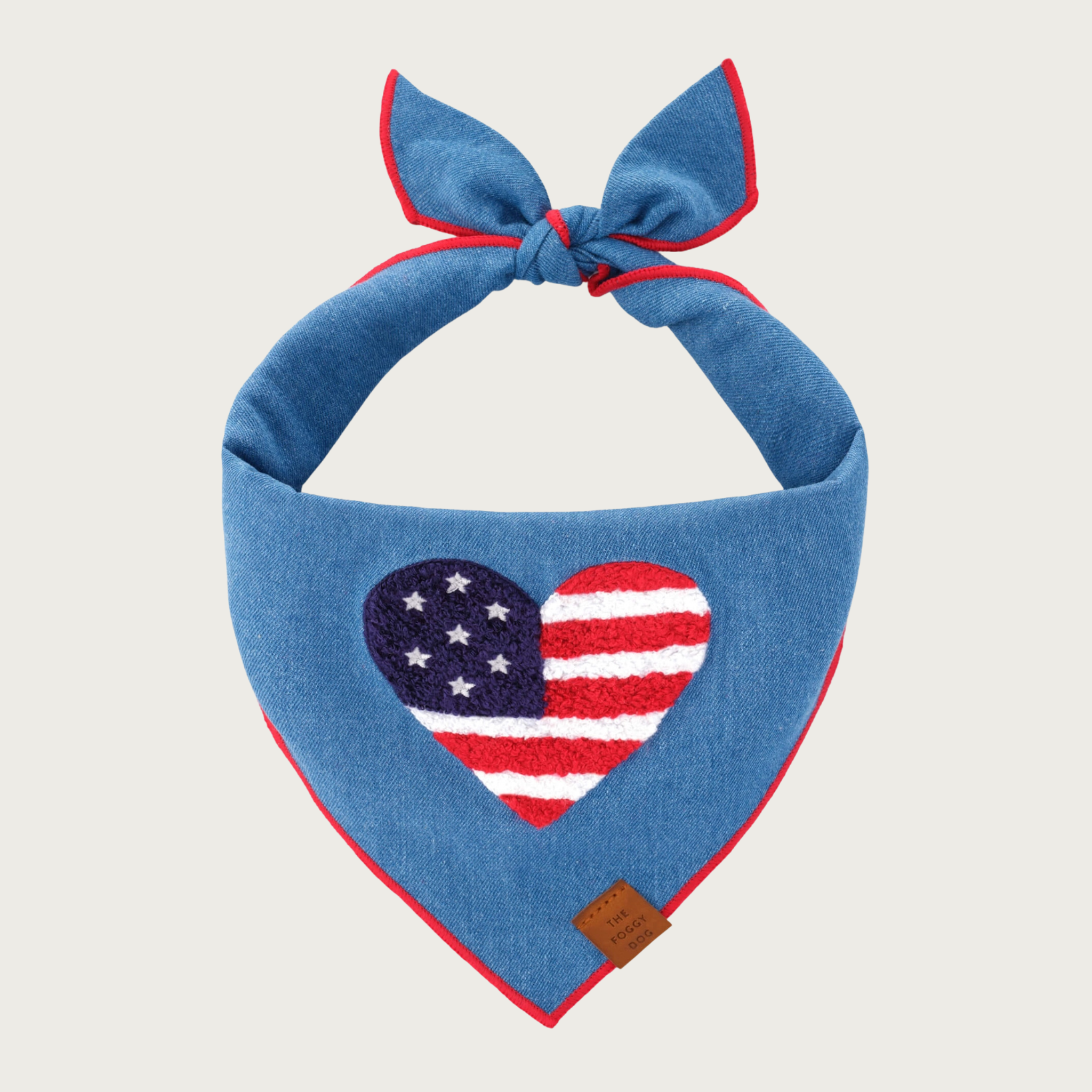 Medium blue denim dog bandana with a chenille applique heart-shaped American flag in center.