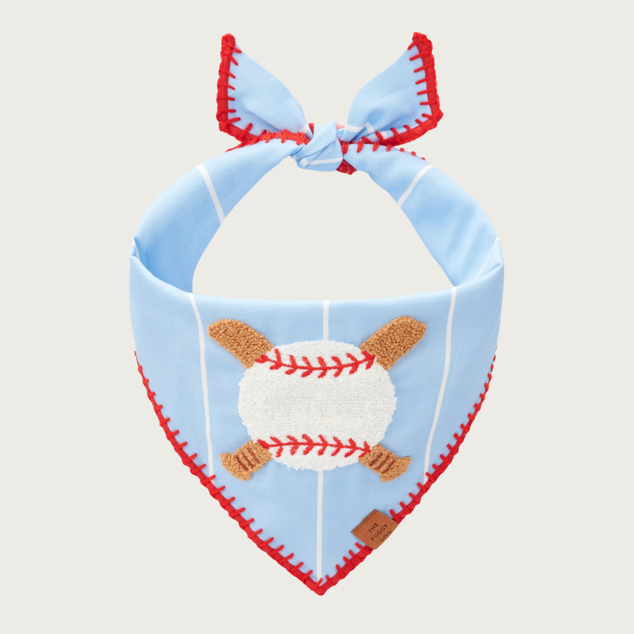 Pale blue dog bandana with wide-spaced narrow white stripes, featuring a chenille applique of a baseball with two criss-cross baseball bats behind it. Red stitching on the hem mimics the stitching in a baseball.