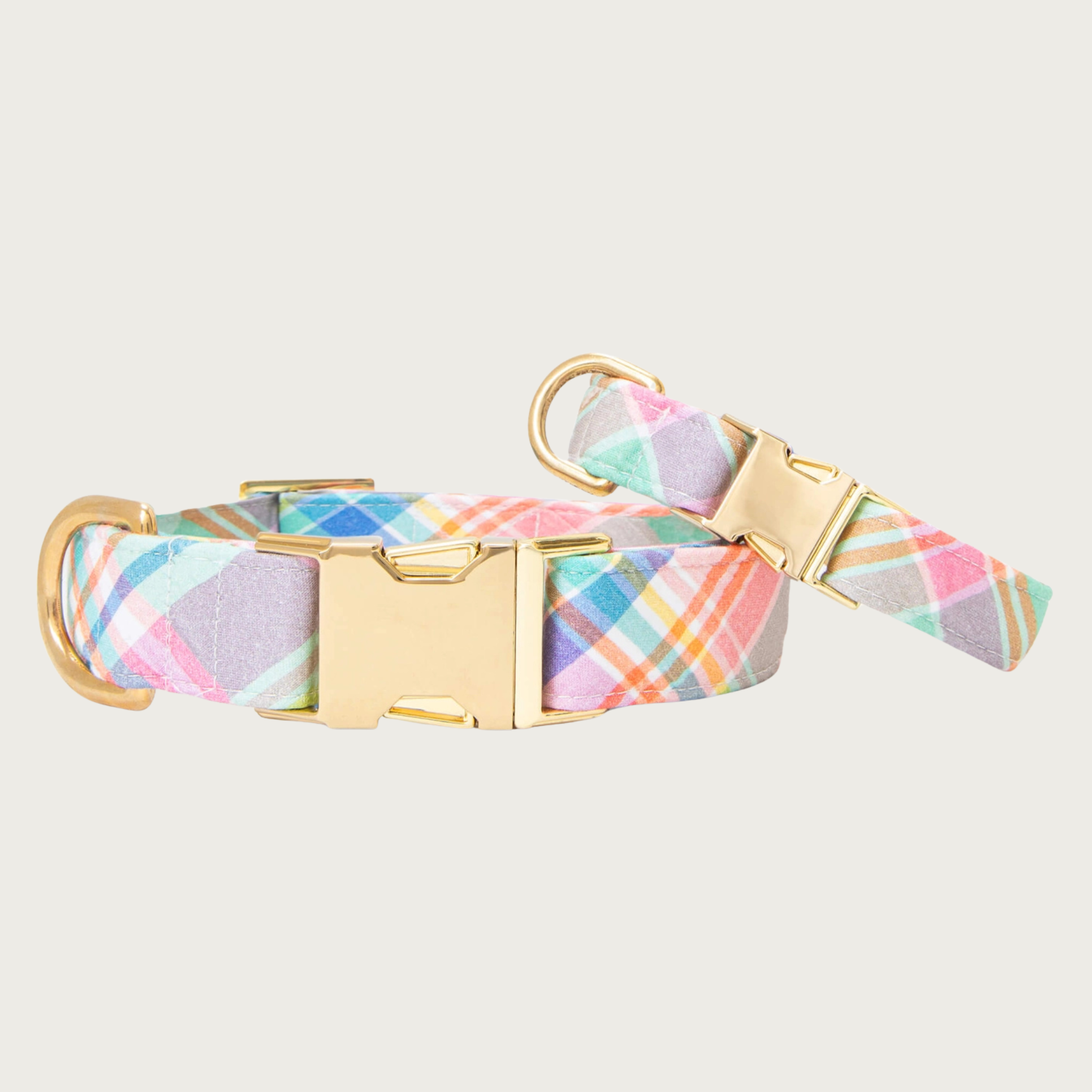 Two Blooming Plaid dog collars with different widths (5/8" and 1"), with the smaller & more narrow collar leaning on the larger one.