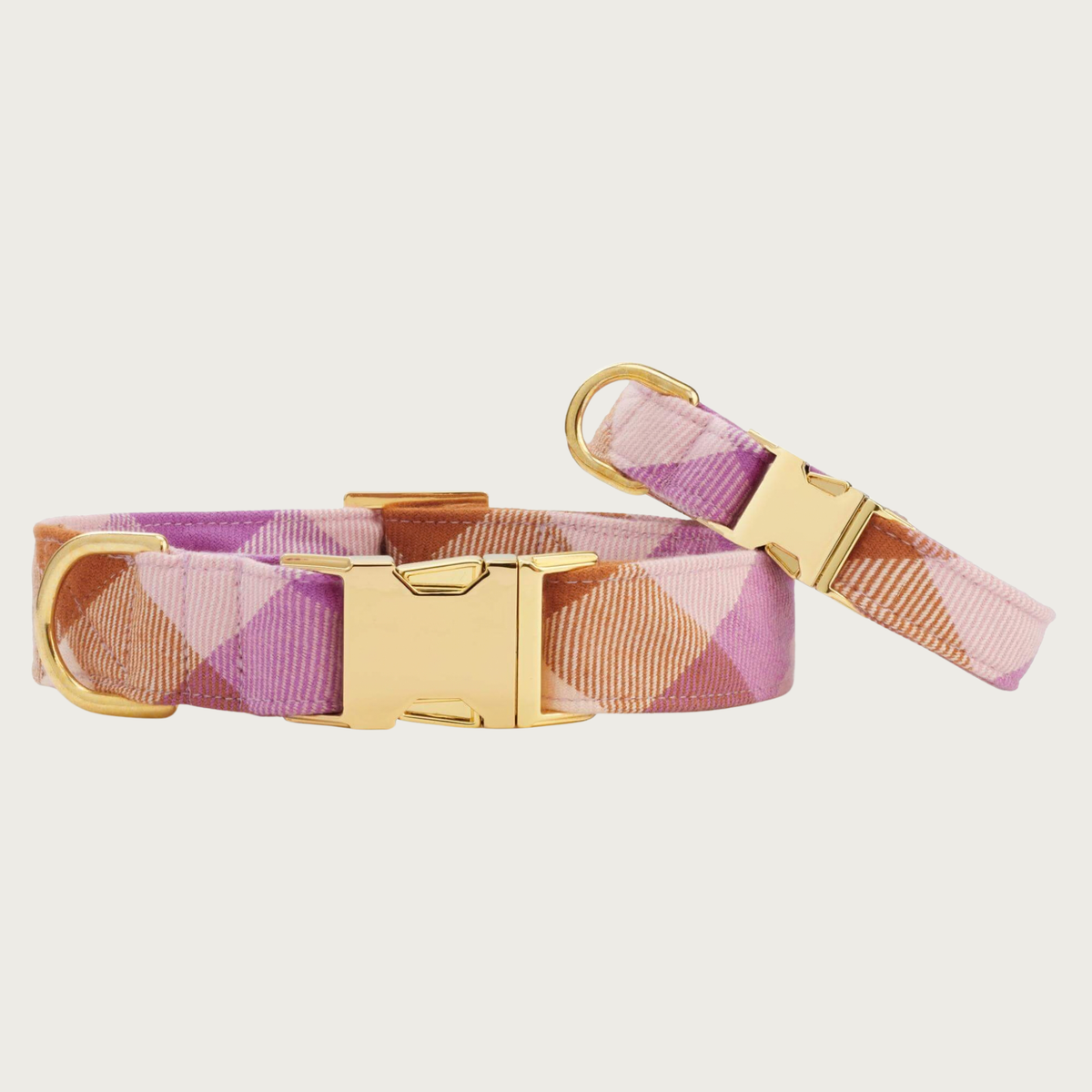 Two Bramble Flannel dog collars with different widths (5/8" and 1"), with the smaller & more narrow collar leaning on the larger one.