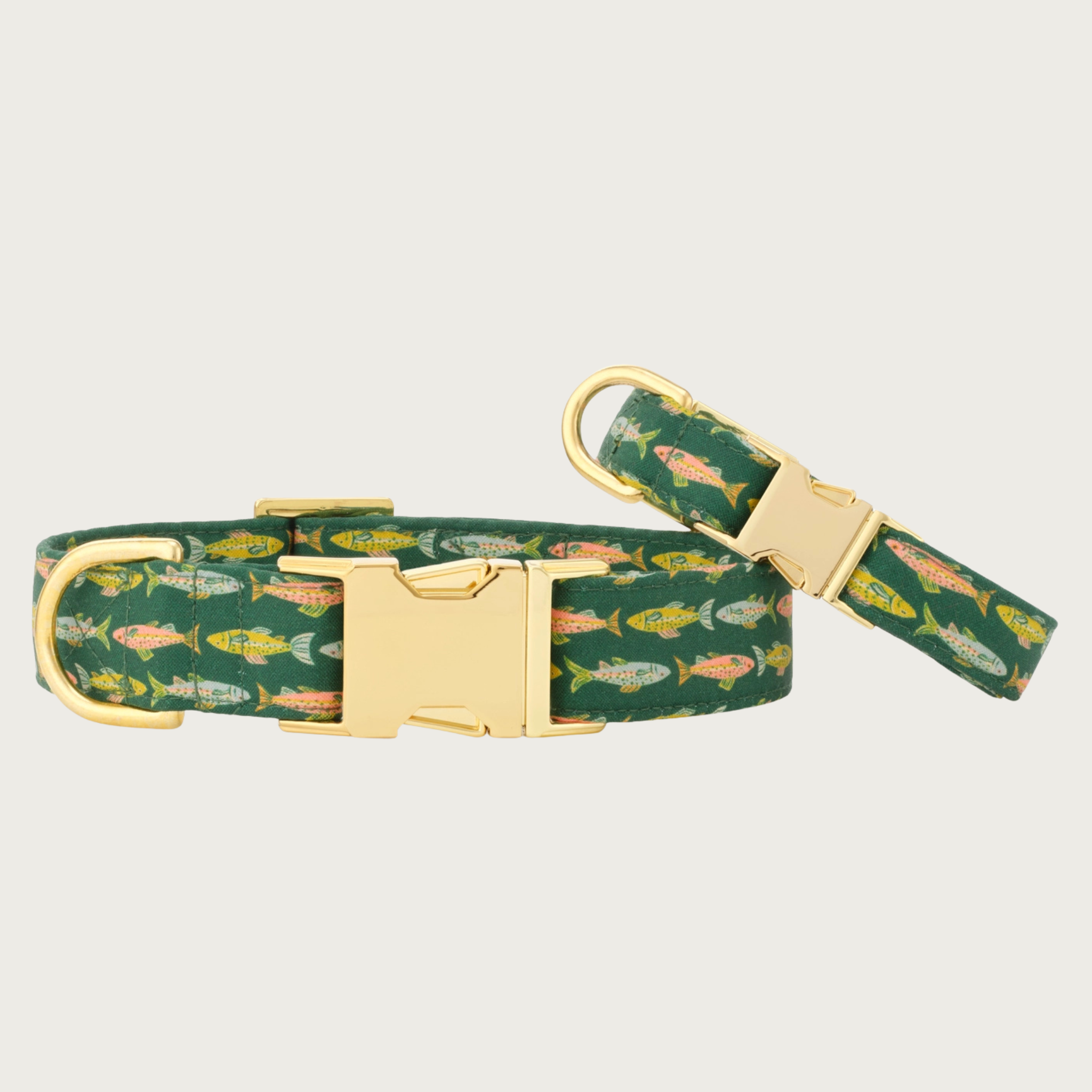 Two Gone Fishing dog collars with different widths (5/8" and 1"), with the smaller & more narrow collar leaning on the larger one.