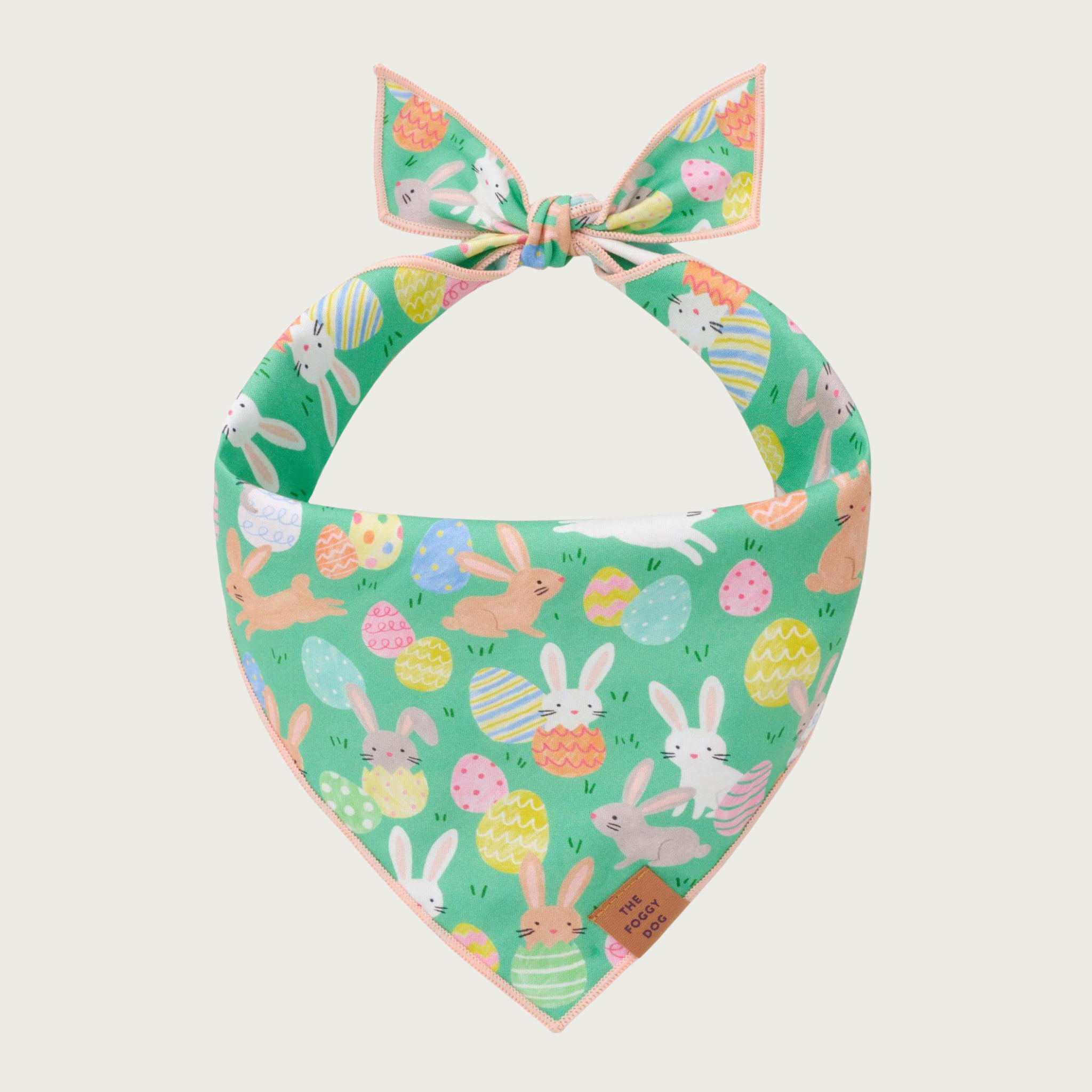 Easter-themed dog bandana with bunnies and decorated Easter eggs on a green background.
