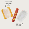Load image into Gallery viewer, Hot Dog toy opened up to show details of each layer, with text descriptors. With arrows pointing to the toy in different locations, text reads "squeaker and crinkle paper inside" and "pull apart layers to hide treats inside."
