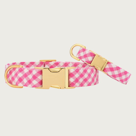 Two Hot Pink Gingham collars with different widths (5/8" and 1"), with the smaller & more narrow collar leaning on the larger one.
