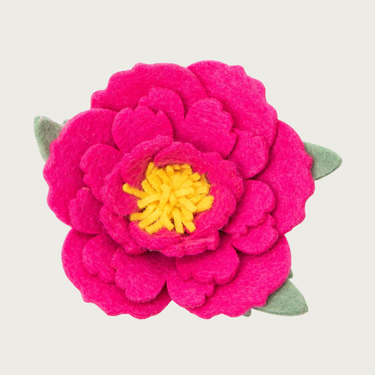 Layered hot pink felt peony dog collar flower with rounded, scalloped edges, with yellow center, and light green felt leaves.