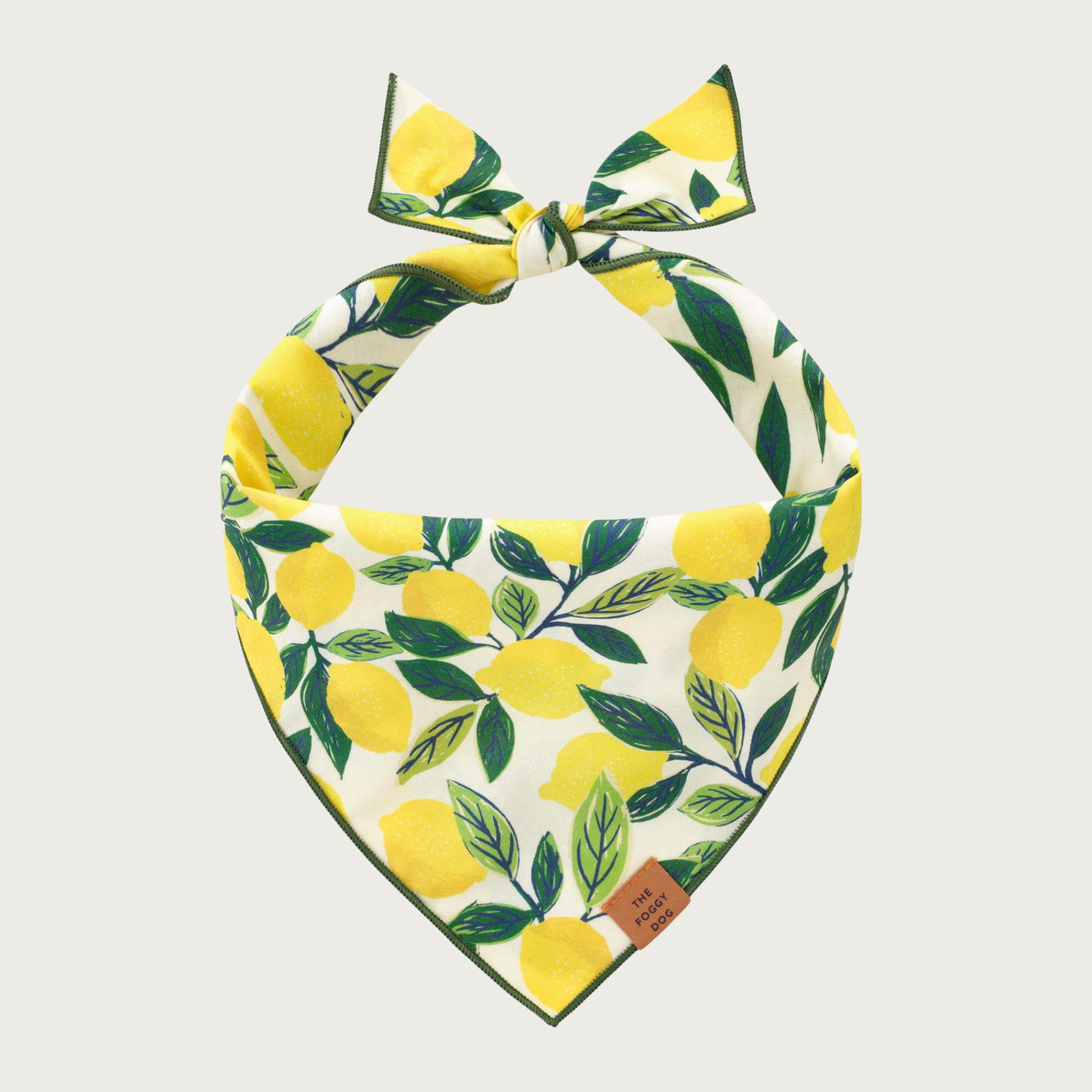 Dog bandana with a bright yellow lemon pattern with green foliage.