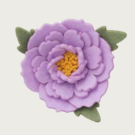 Layered lilac purple felt peony dog collar flower with rounded, scalloped edges, with yellow center, and light green felt leaves.