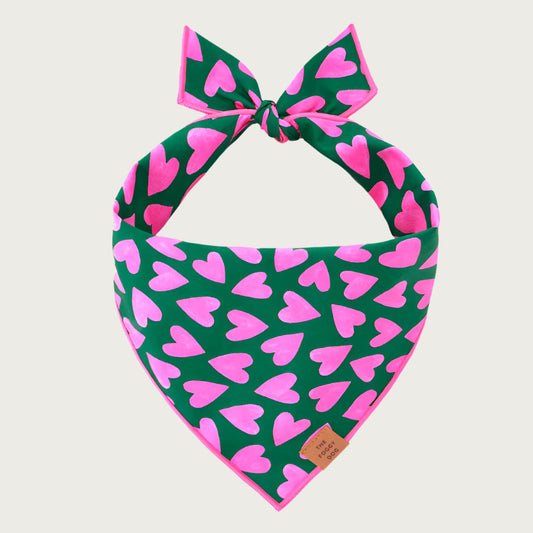 Hot pink heart pattern on hunter green dog bandana.