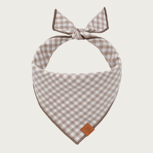 A light taupe-brown and white gingham tie-on dog bandana.