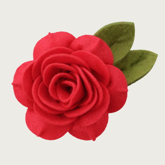 Layered red felt rose-shaped dog collar flower with green felt leaves.