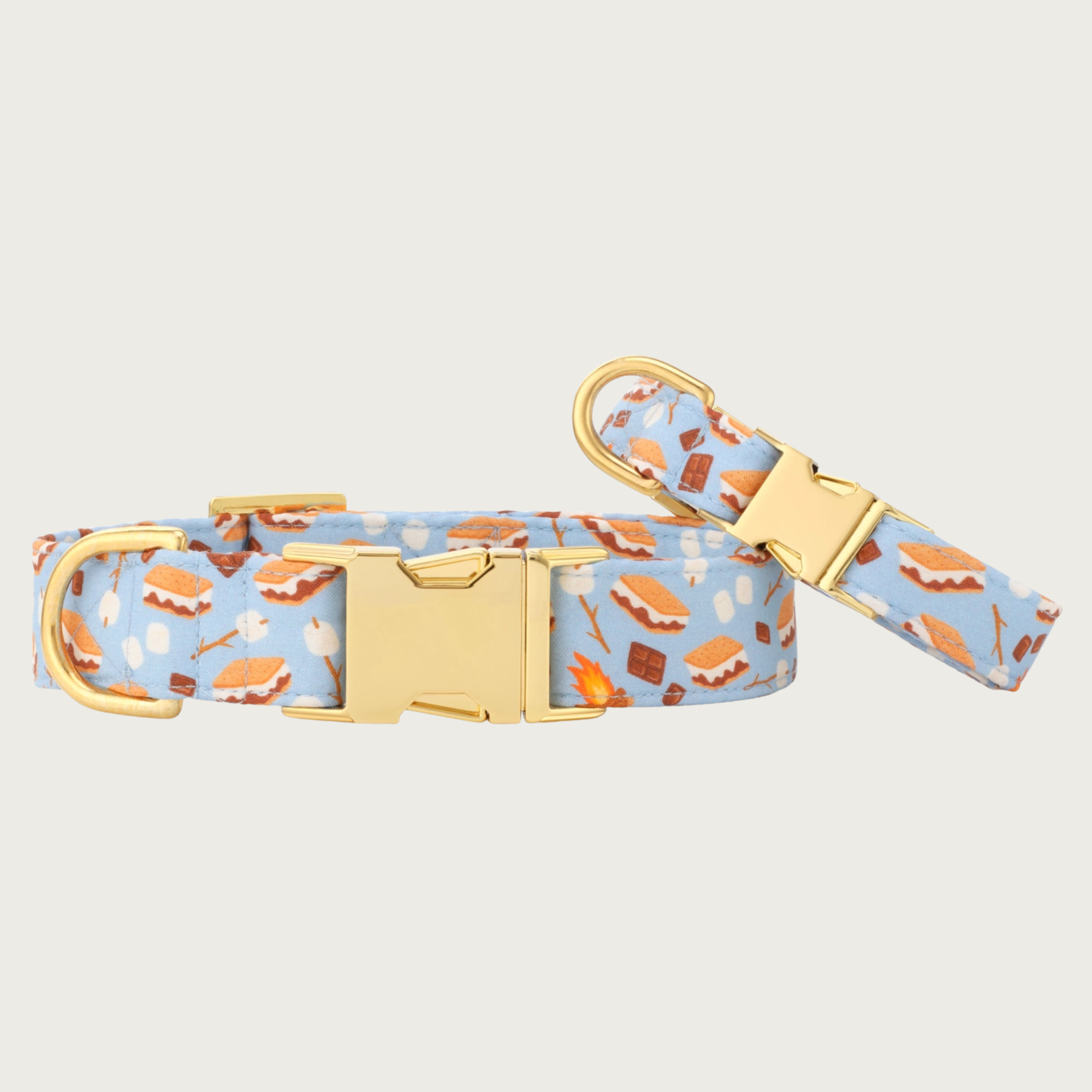 Two S'more to Love dog collars with different widths (5/8" and 1"), with the smaller & more narrow collar leaning on the larger one.