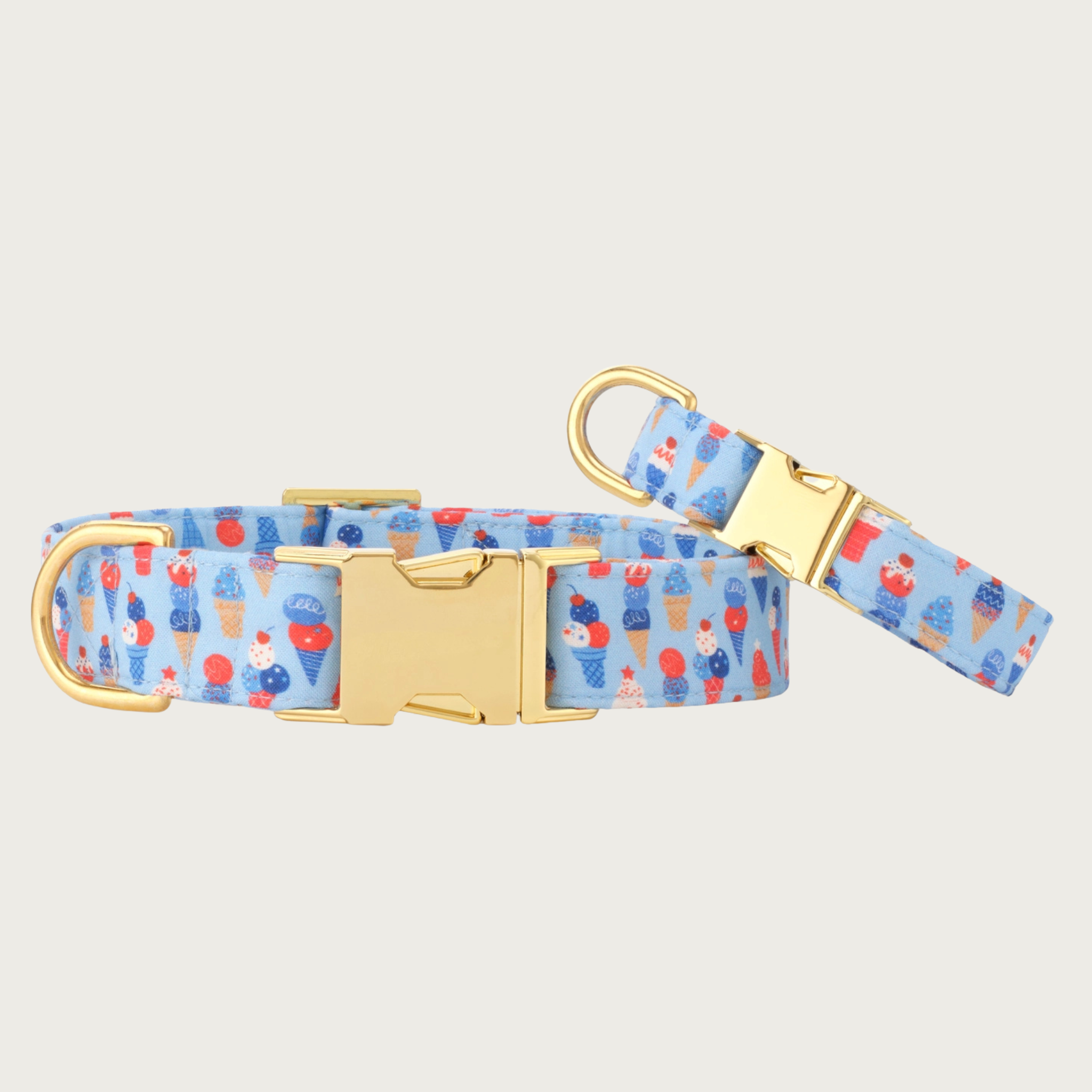 Two Star-Spangled Scoops dog collars with different widths (5/8" and 1"), with the smaller & more narrow collar leaning on the larger one.