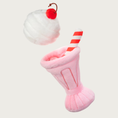 Load image into Gallery viewer, Plush strawberry milkshake dog toy, taken apart to show details of each piece. Inside the pink glass are visible treat pockets. The white ice cream scoop is loose and separate from the glass.

