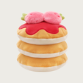 Load image into Gallery viewer, Plush dog toy resembling a stack of layered pancakes. The 3 pancakes are tan on top and cream colored underneath, on the very top one there is a red "puddle" of syrup and two large plush strawberries.

