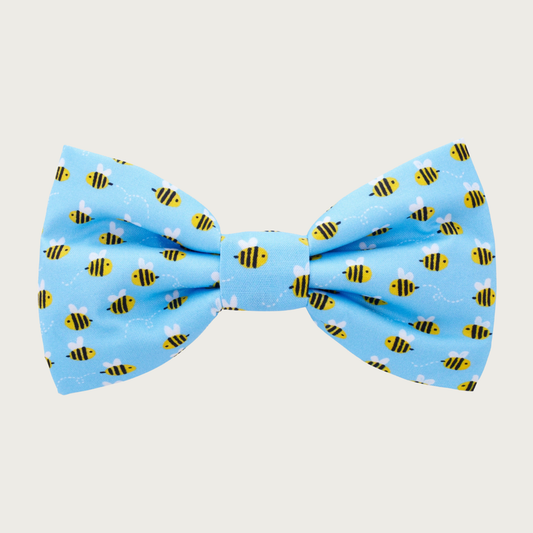 Medium sky blue dog bow tie with simple & cute flying bee print.