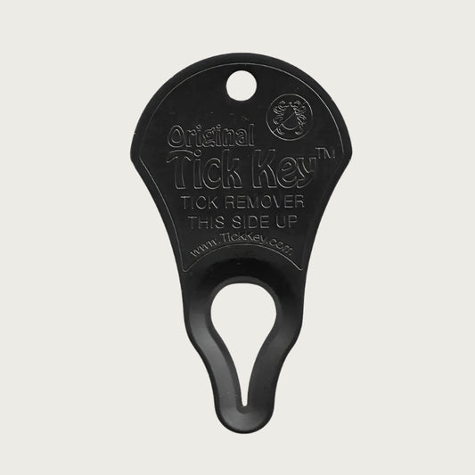 Small, pie-slice shaped Original Tick Key in matte black. Small hole on top for attaching to a keychain. Larger, tapered raindrop sized hole on the bottom, for removing tick.