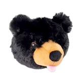 A plush ball in the shape of a black bear's head. It has embroidered eyes, tan muzzle, black nose and a pink tongue that is playfully sticking out of its mouth.