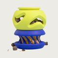 Load image into Gallery viewer, A two-piece rubber dog toy consisting of a bright lime green top section (The Boomerang) connected to a royal blue bottom section (The Slobber).
