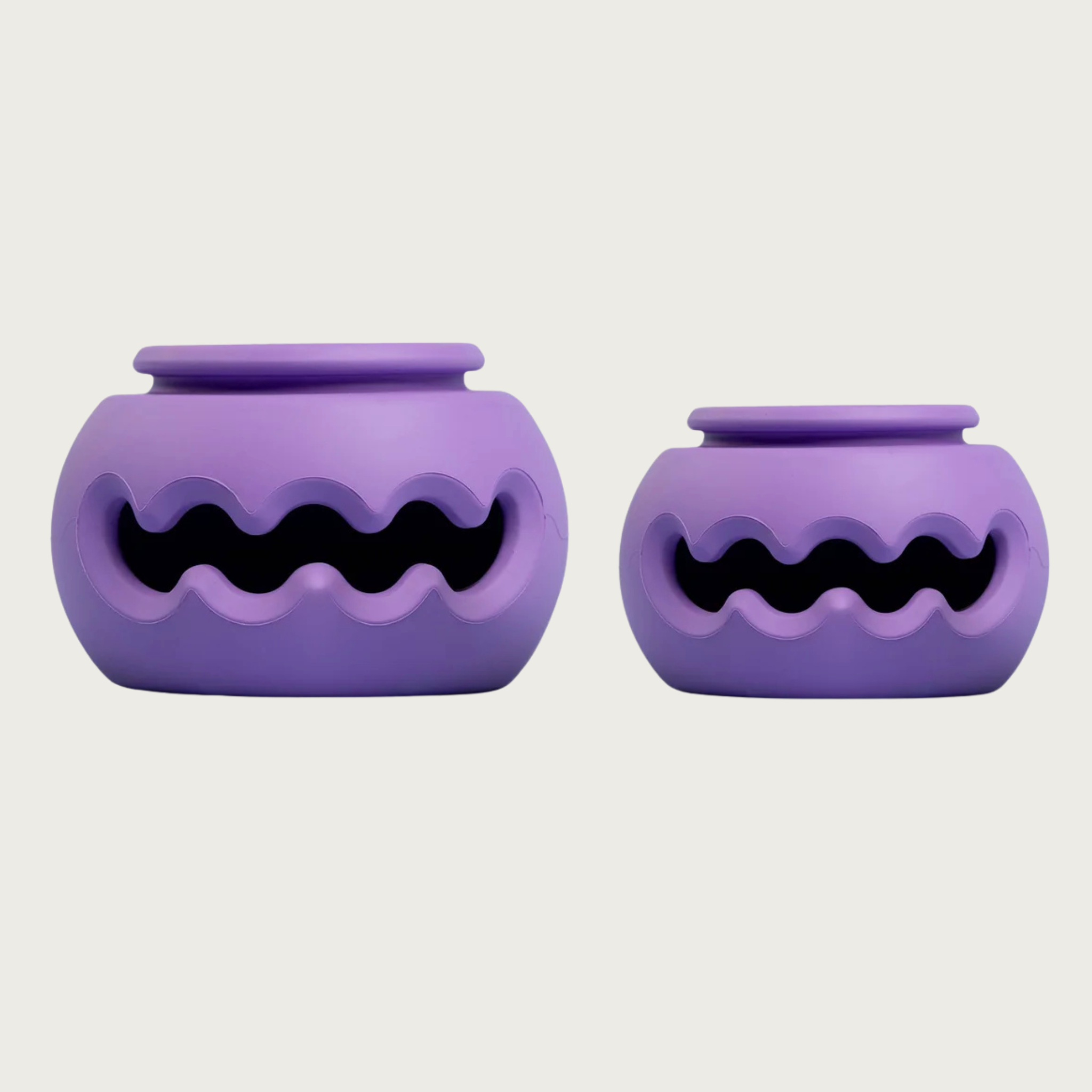 Both sizes of The Squiggle dog toy, side by side to show size difference.