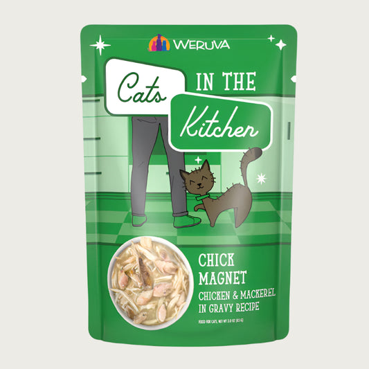 A 3 oz green pouch of Weruva Cats in the Kitchen, Chick Magnet, chicken & mackerel in gravy recipe wet food for cats. Image on pouch shows actual food, which is chunks of mackerel and shreds of chicken in gravy.