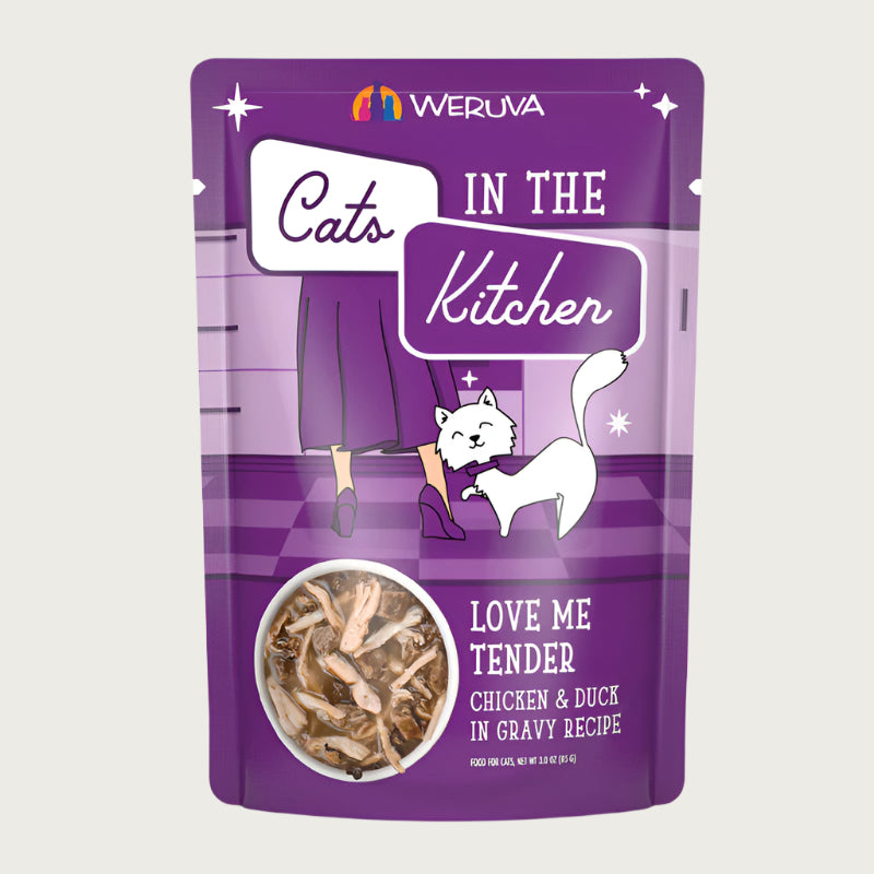 A 3 oz purple pouch of Weruva Cats in the Kitchen, Love Me Tender, chicken & duck in gravy recipe wet food for cats. Image on pouch shows actual food, which is chunks and shreds of chicken, duck, and tuna in gravy.