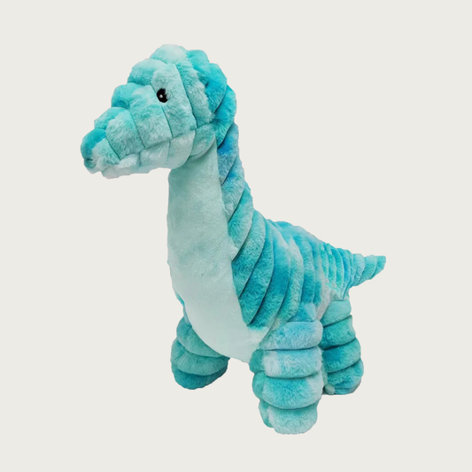 A large, plush dog toy shaped like a brachiosaurus dinosaur. Most of its body is a wide wale ribbed plush, with smooth chest. Its body is various shades of turquoise, with pale turquoise chest.