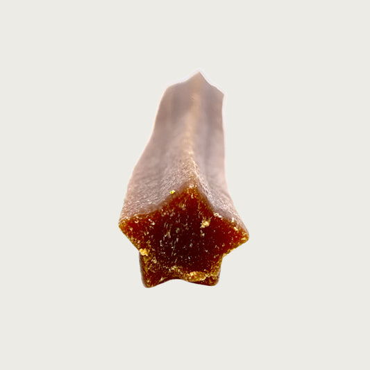 Close-up photo of one end of the bacon crunchy, to show its star shaped detail.