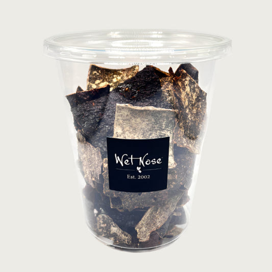 4 oz plastic container with lid, of Wet Nose Beef Crispies dog & cat treats. Product inside is dark brown, thin squares.