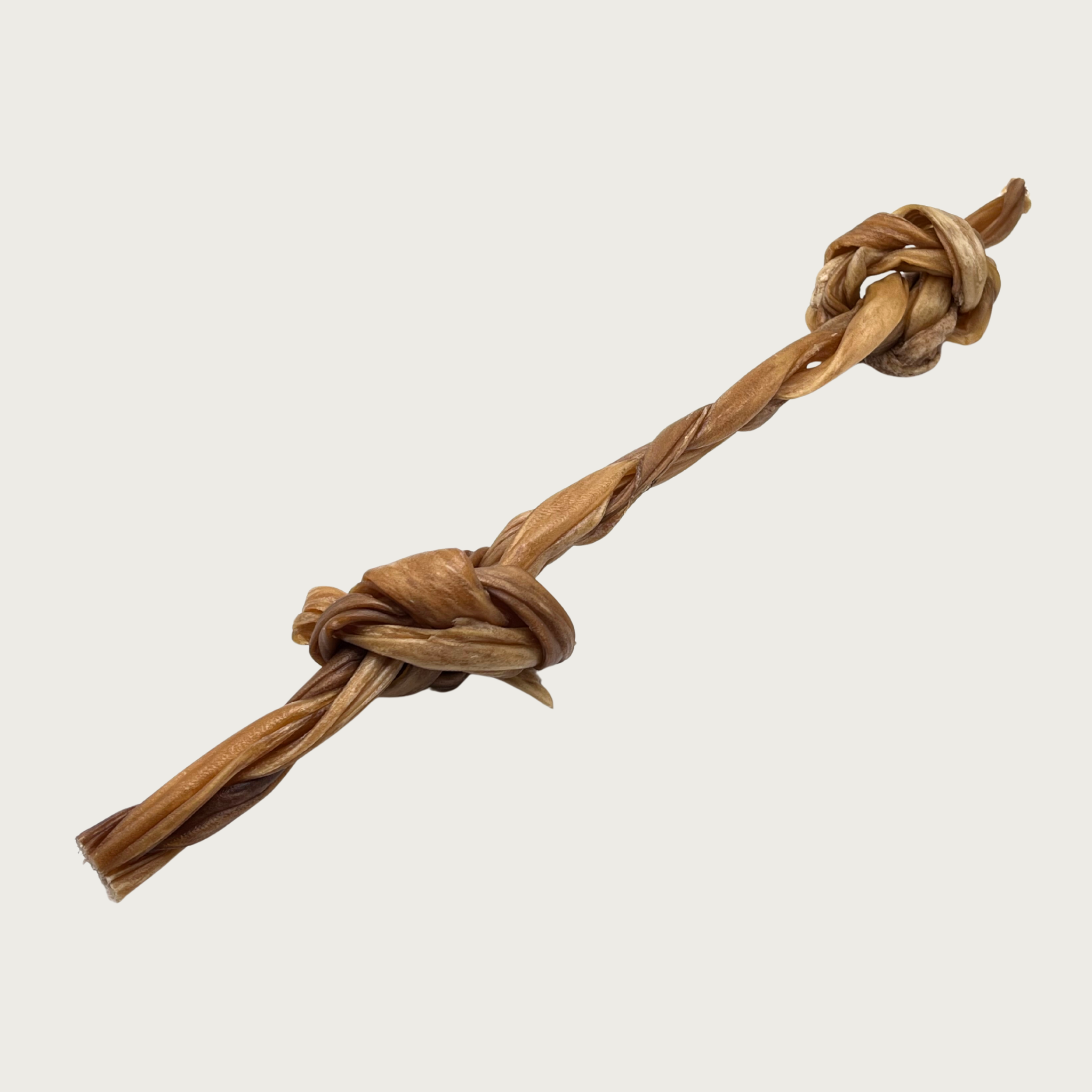 Large, brown, braided dog chew that has thick knots near each end.