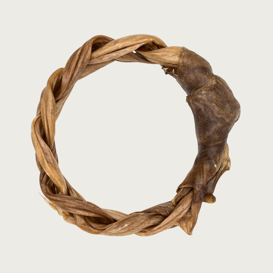 Braided, brown, ring-shaped dog chew.