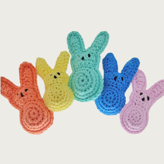 Group of 5 crocheted bunny toys, in assorted colors.