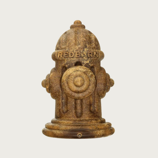 Brownish-green colored dog chew in the shape of a fire hydrant.