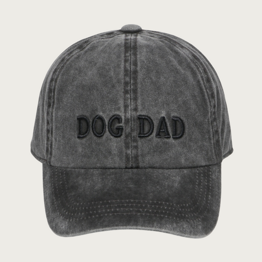 Vintage washed black cap with 'DOG DAD' in black all-caps text. Cap looks dark gray due to the washed effect.