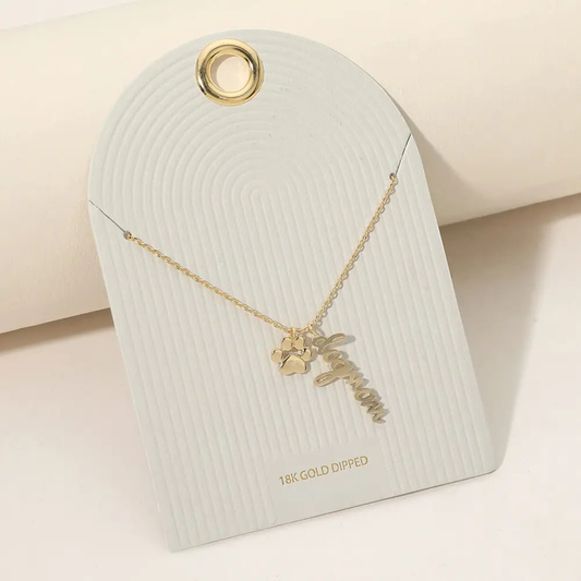 Alternate view of the Dog Mom Necklace on an ivory jewelry card with '18K Gold Dipped' text.