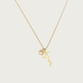 Load image into Gallery viewer, Delicate gold chain necklace with 'dogmom' pendant in script text, with a small paw print charm next to it.
