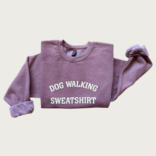 Heathered purple sweatshirt with 'DOG WALKING SWEATSHIRT' text in center, in all caps.