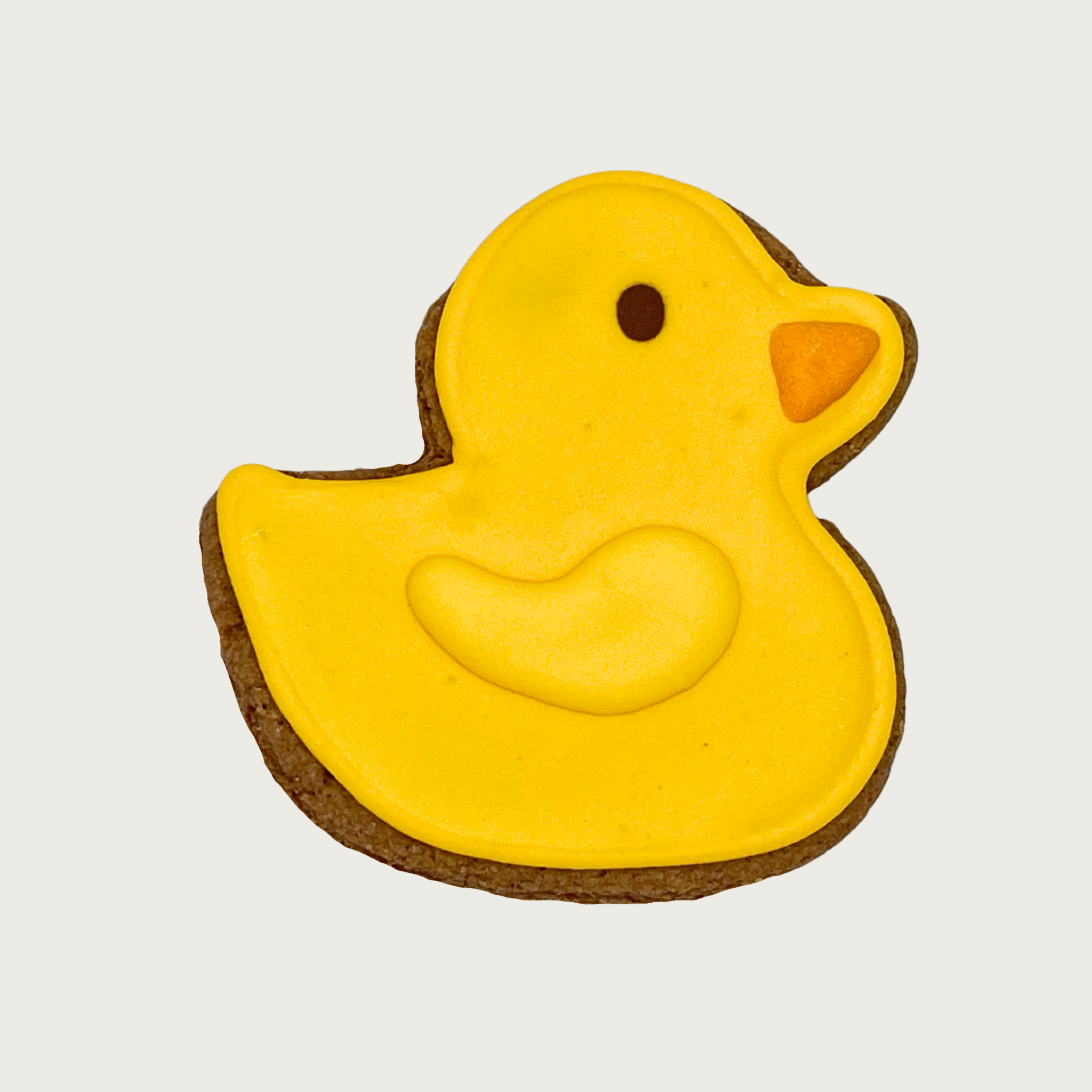 Yellow rubber duck-shaped dog cookie with an orange bill.