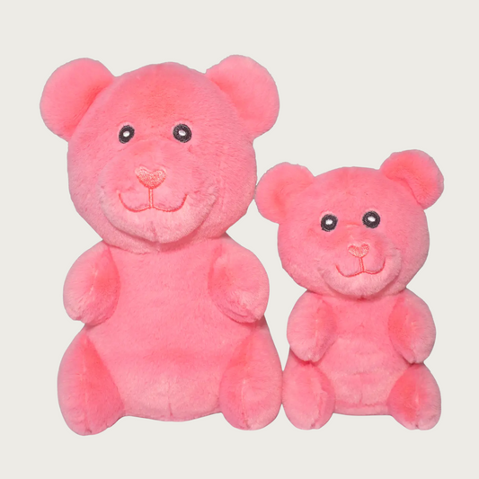 Two plush salmon pink gummy bear shaped dog toys, side by side to show size difference.