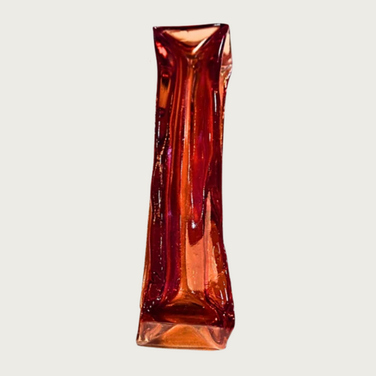 Rectangular stick-shaped, dark red colored dog chew that is transparent.