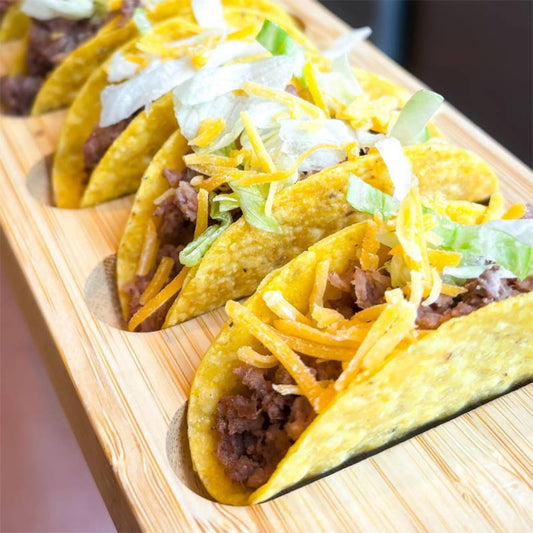 Mini Ground Beef Taco treats for dogs, side by side on a wooden serving platter.
