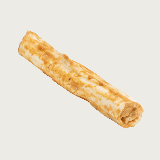 An example of the No-Hide Wrap chew for dogs. All flavors look similar.  It is a rolled, straight shaped chew, with the flavor topping smeared across it. Base color is light tan, "smear" ranges from light tan to light brown.