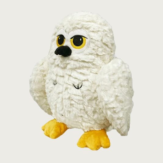 White textured plush owl dog toy with yellow feet, black beak, and large black & yellow eyes.  