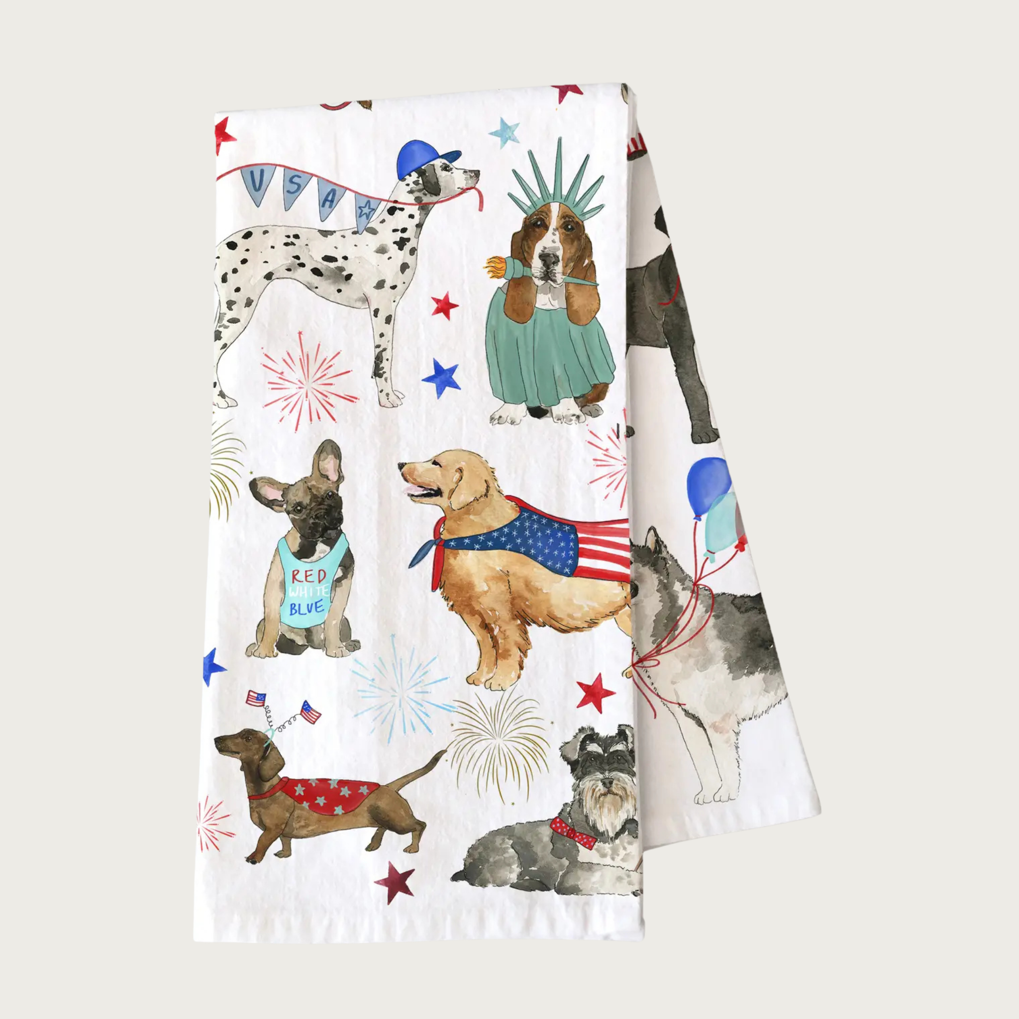 Decorative 4th of July-themed tea towel with many different dog breeds, wearing patriotic outfits, hats, bandanas, caps & banners. White towel with dog illustrations that look like they were done in ink & watercolor.