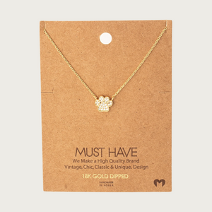 Delicate gold-toned, fine-linked chain necklace featuring a gold-toned dog paw print charm filled with cubic zirconia stones. Charm is connected to the necklace on two sides-it does not dangle.